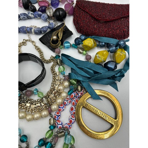 511 - A collection of costume jewellery to include a jet bracelet, Murano glass bracelet, other beaded bra... 