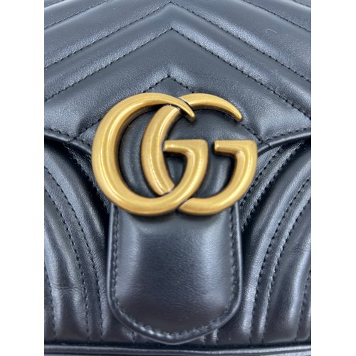 877 - A genuine Marmont Gucci black leather bag with gold coloured hardware, comes with dust bag.