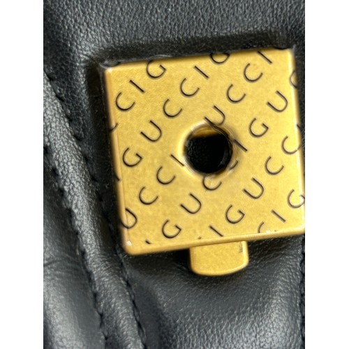 877 - A genuine Marmont Gucci black leather bag with gold coloured hardware, comes with dust bag.