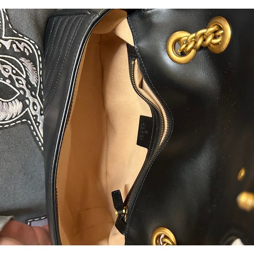 877 - A genuine Marmont Gucci black leather bag with gold coloured hardware, comes with dust bag.