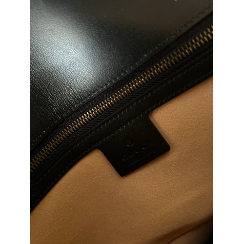 877 - A genuine Marmont Gucci black leather bag with gold coloured hardware, comes with dust bag.