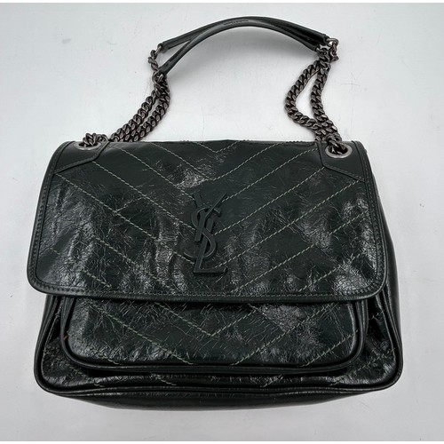 879 - A genuine Yves Saint Laurent Niki leather bag in green with dust bag and box.