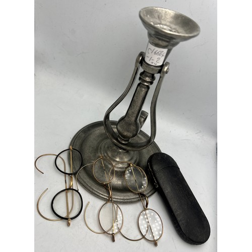 1232 - Pewter gimble mounted candlestick together with three yellow metal framed spectacles and one spectac... 