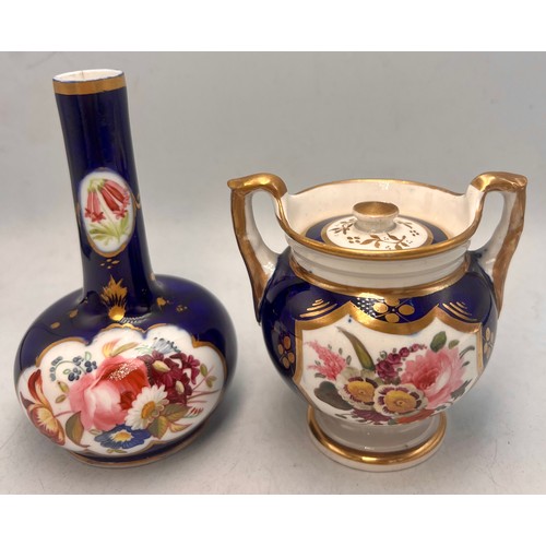 447 - A lidded pot with hand painted floral panel together with a blue, gilt and floral painted vase.