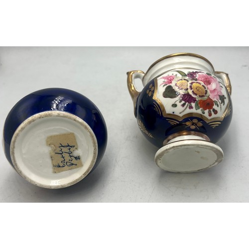 447 - A lidded pot with hand painted floral panel together with a blue, gilt and floral painted vase.