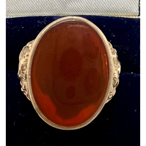 625 - A nine carat gold carnelian ring. Size S/T. Weight 7.7gm.