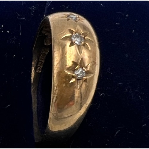 626 - A nine carat gold ring set with three clear stones. Size Q. Weight 2.2gm.