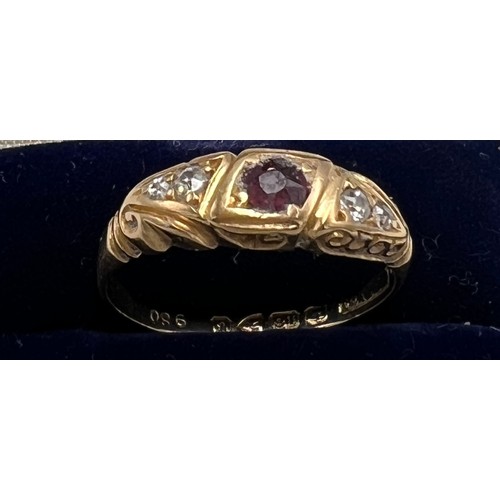 627 - A eighteen carat gold ring set with diamonds and central pink stone. Size O. Weight 3.3gm.