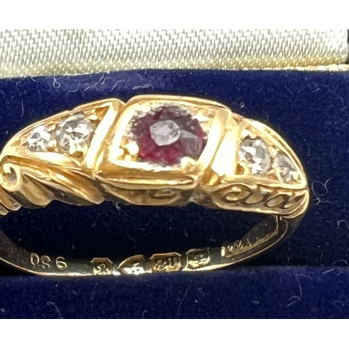 627 - A eighteen carat gold ring set with diamonds and central pink stone. Size O. Weight 3.3gm.