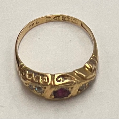 627 - A eighteen carat gold ring set with diamonds and central pink stone. Size O. Weight 3.3gm.