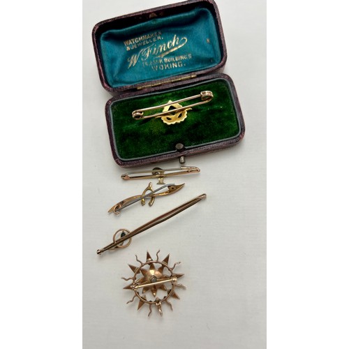 628 - Three 9 carat gold bar brooches and an unmarked yellow metal and seed pearl bar brooch in fitted cas... 