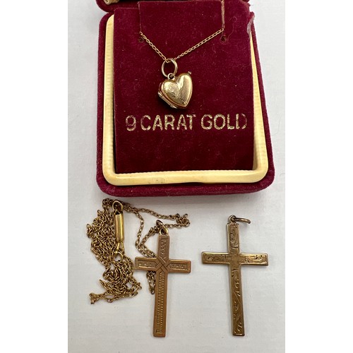 631 - Nine carat gold crucifix on 9 carat gold chain, a 9 carat gold heart shaped locket and chain, total ... 