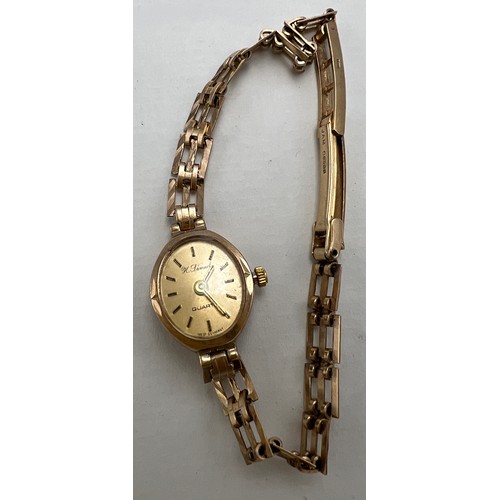 718 - A 9 carat gold ladies wristwatch and bracelet strap. H Samuel, quartz to face. Total weight 9gm.