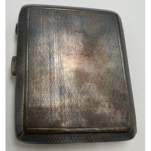 834 - A hallmarked silver cigarette case. Weight 97.3gm.