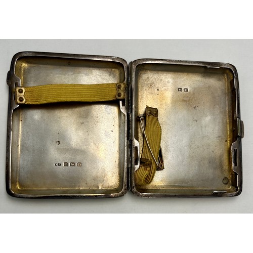 834 - A hallmarked silver cigarette case. Weight 97.3gm.