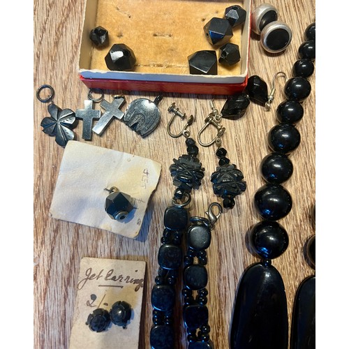 639 - Whitby jet and other jewellery to include jet earrings on original card, necklaces, carved floral br... 