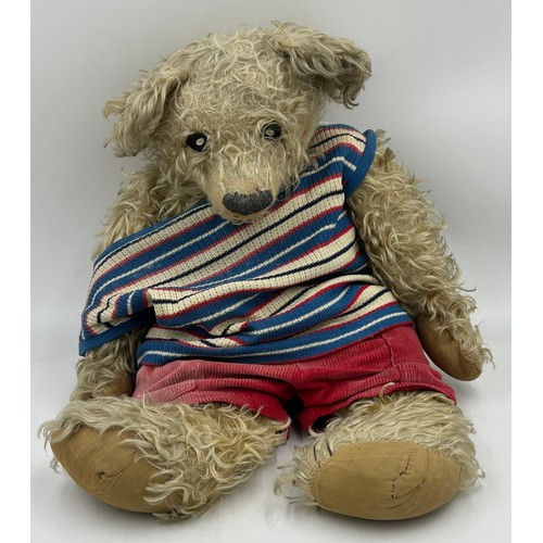 1128 - Vintage straw filled teddy bear measuring approx 66cm.