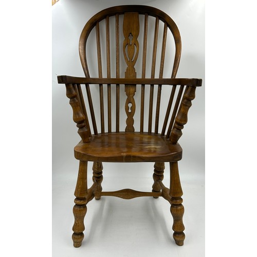 52 - A 20thC child's Windsor chair. 7cm h.