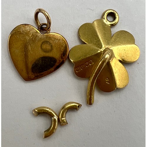 646 - Two gold charms to include four leaf clover marked 18 carat gold and heart, tests as 18 carat gold. ... 