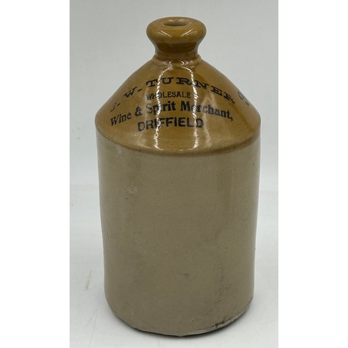 1238 - A collection of stoneware comprising a J.W. Turner, Driffield half gallon flagon, 2 x Victorian port... 