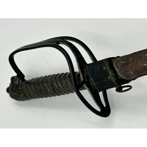 1018 - An early 18thC Naval Officers Hanger Sword with 66cm curved blade, ribbed grip, three bar brass guar... 