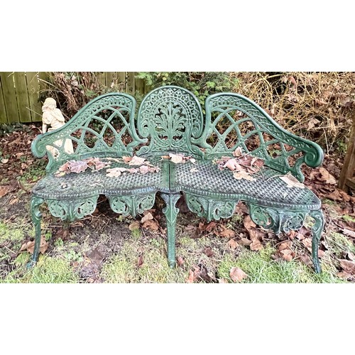 13 - A decorative green metal garden seat. 130 w x 76cm h.