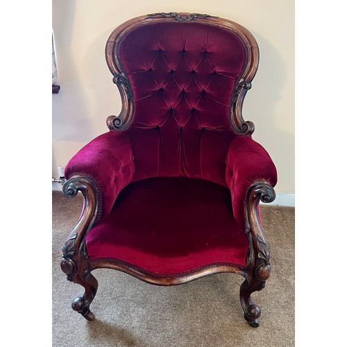 71 - A 19thC button backed armchair with cabriole legs and swept arms upholstered in red velvet. 105 h x ... 