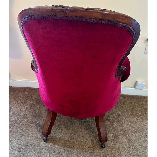 71 - A 19thC button backed armchair with cabriole legs and swept arms upholstered in red velvet. 105 h x ... 