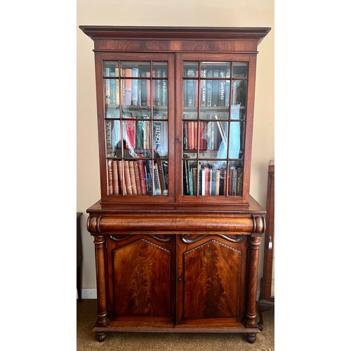 75 - A 19thC mahogany 2 door cupboard with frieze drawer and associated 2 door glazed bookcase to top. 20... 