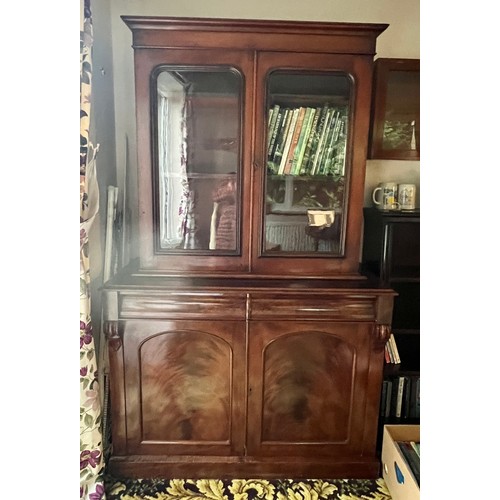 83 - A 19thC mahogany bookcase over cupboard base, 2 glazed doors over 2 door, 2 drawer base with cellare... 