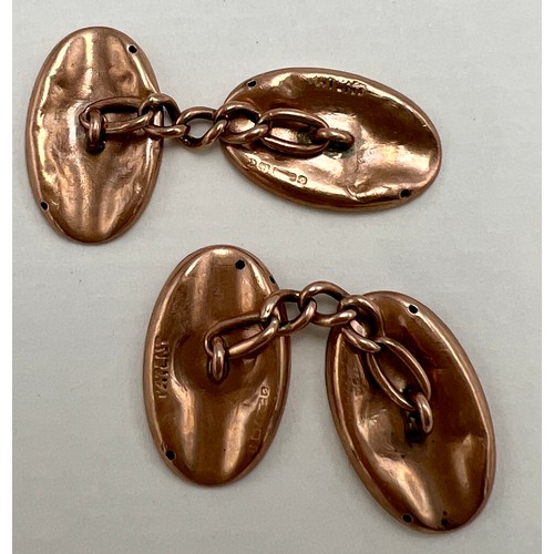 655 - A pair of 9 carat gold cufflinks with foliate scroll engraving. Weight 5.1gm.