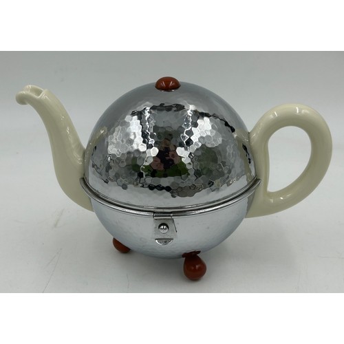 1240 - A circa 1950's German teapot, coffee pot, milk and sugar by WMF, the porcelain teapot 13cm h and cof... 