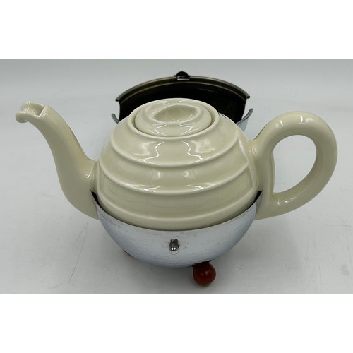 1240 - A circa 1950's German teapot, coffee pot, milk and sugar by WMF, the porcelain teapot 13cm h and cof... 