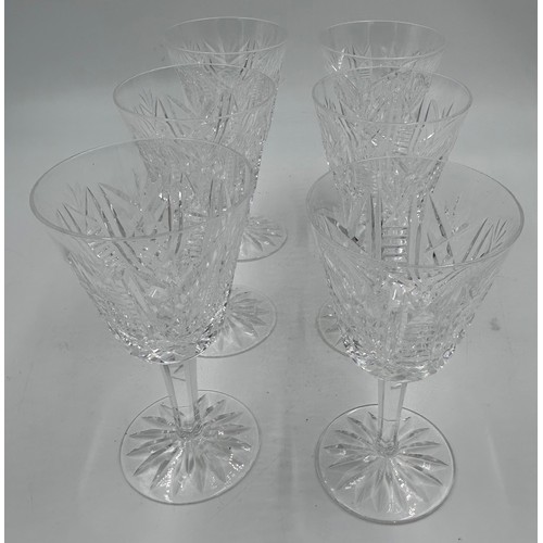 501 - A set of 6 Waterford Crystal ‘Clare’ wine glasses and a matching decanter, 34cm to top of stopper.