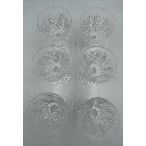 501 - A set of 6 Waterford Crystal ‘Clare’ wine glasses and a matching decanter, 34cm to top of stopper.