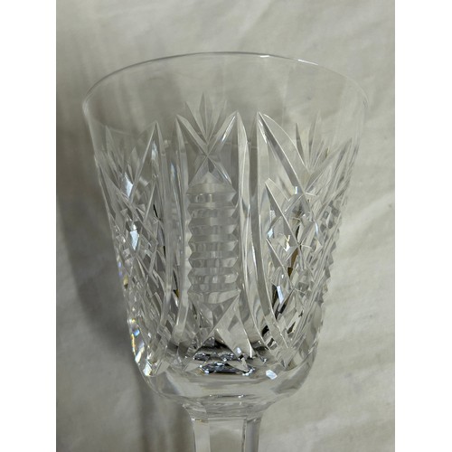 501 - A set of 6 Waterford Crystal ‘Clare’ wine glasses and a matching decanter, 34cm to top of stopper.