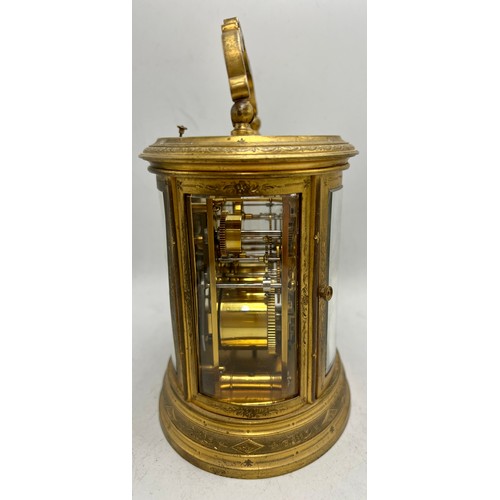 996 - A 19thC brass repeater carriage clock with French movement and alarm. 19cm h to top of handle.