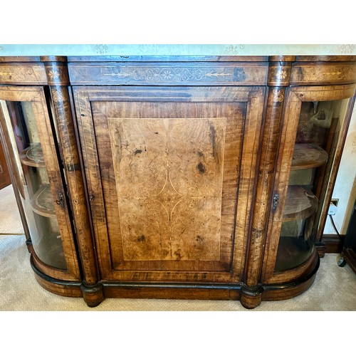 86 - A burr walnut inlaid credenza sideboard with curved glass doors to each side with two shelves. Centr... 