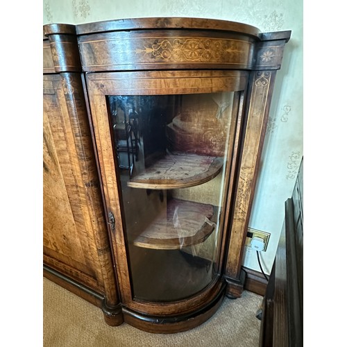 86 - A burr walnut inlaid credenza sideboard with curved glass doors to each side with two shelves. Centr... 