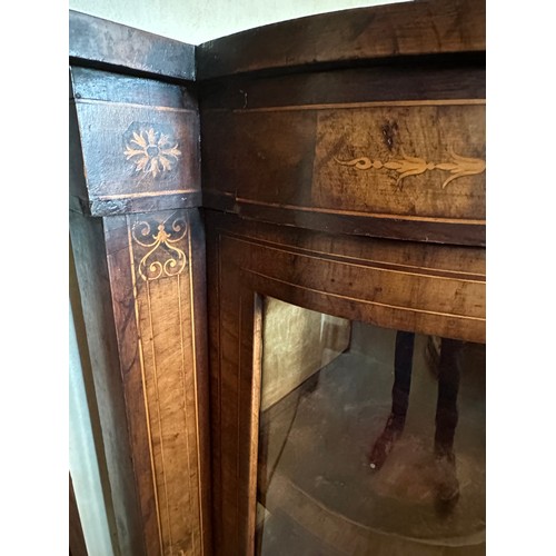 86 - A burr walnut inlaid credenza sideboard with curved glass doors to each side with two shelves. Centr... 