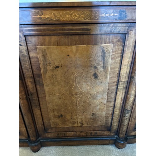 86 - A burr walnut inlaid credenza sideboard with curved glass doors to each side with two shelves. Centr... 