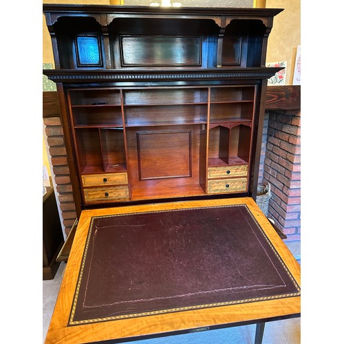 87 - A mahogany drop front writing desk with single drawer. Interior with compartments, four drawers with... 