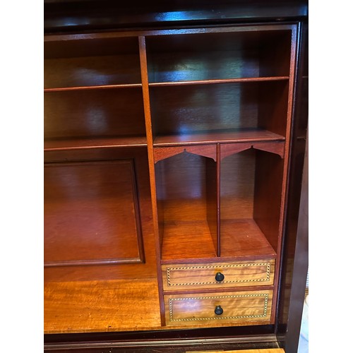 87 - A mahogany drop front writing desk with single drawer. Interior with compartments, four drawers with... 