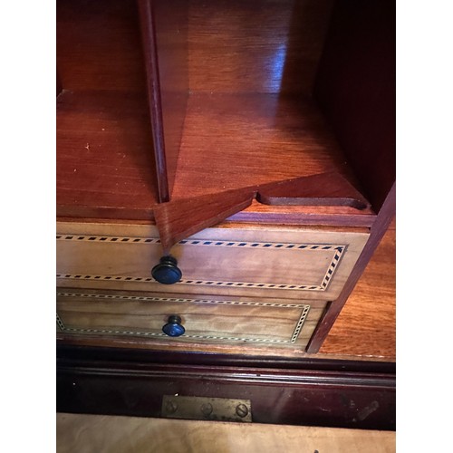 87 - A mahogany drop front writing desk with single drawer. Interior with compartments, four drawers with... 