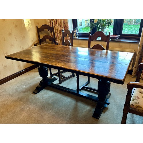 88 - An oak table with single stretcher together with 6 ladder back chairs and two carvers. Table 182 l x... 