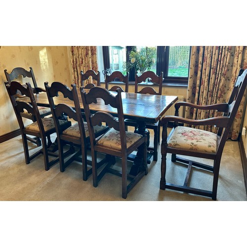 88 - An oak table with single stretcher together with 6 ladder back chairs and two carvers. Table 182 l x... 