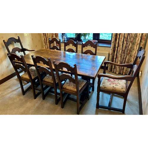 88 - An oak table with single stretcher together with 6 ladder back chairs and two carvers. Table 182 l x... 