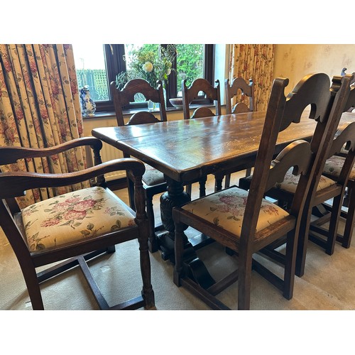 88 - An oak table with single stretcher together with 6 ladder back chairs and two carvers. Table 182 l x... 