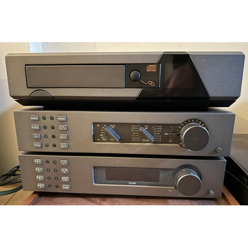 946 - A Quad Hi Fi, to include Quad 306 amplifier, FM 4 Tuner, 34 Control Unit and CD player on stand circ... 