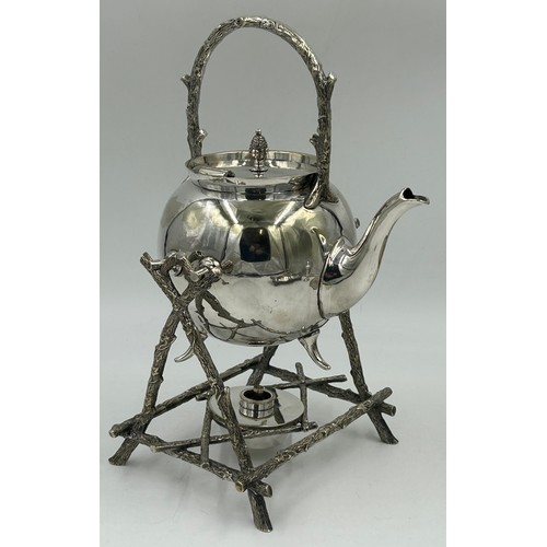 770 - Silverplate items to include a good quality spirit kettle 32cm h, a pair of candle holders with snuf... 